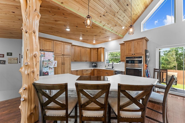 770 Mills Hollow Rd, Branson, MO 65616 - kitchen featuring wood ceiling, stainless steel appliances, a breakfast bar, hanging light fixtures, and light countertops