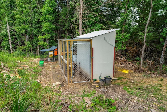 770 Mills Hollow Rd, Branson, MO 65616 - view of poultry coop with a forest view