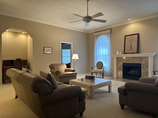 3454 W Countryside Dr, Springfield, MO 65807 - living area featuring light carpet, ceiling fan, crown molding, a fireplace, and a textured ceiling