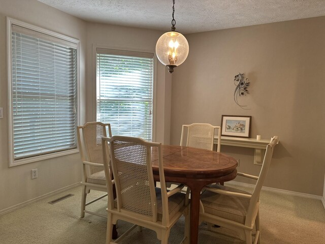 3454 W Countryside Dr, Springfield, MO 65807 - dining room featuring carpet flooring and a textured ceiling