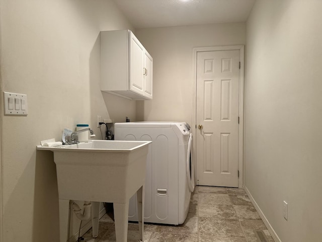 3454 W Countryside Dr, Springfield, MO 65807 - laundry room with washer / clothes dryer, cabinet space, and light stone finish floors