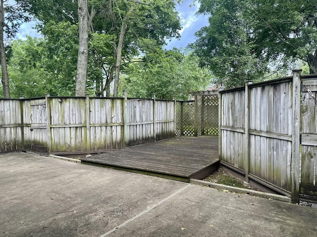 3454 W Countryside Dr, Springfield, MO 65807 - wooden deck featuring a fenced backyard and a patio