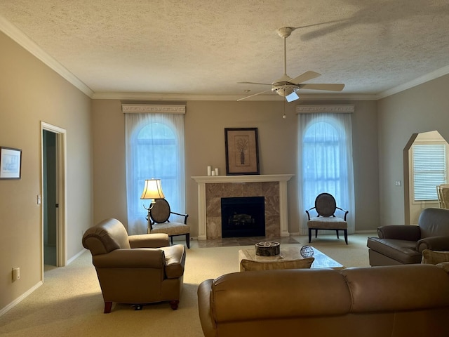 3454 W Countryside Dr, Springfield, MO 65807 - living room with plenty of natural light, ceiling fan, carpet floors, a textured ceiling, and a fireplace