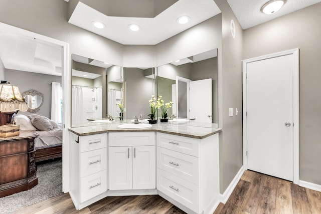 280 W Woodland Dr Unit Ld, Branson, MO 65616 - full bathroom featuring vanity, wood finished floors, and curtained shower