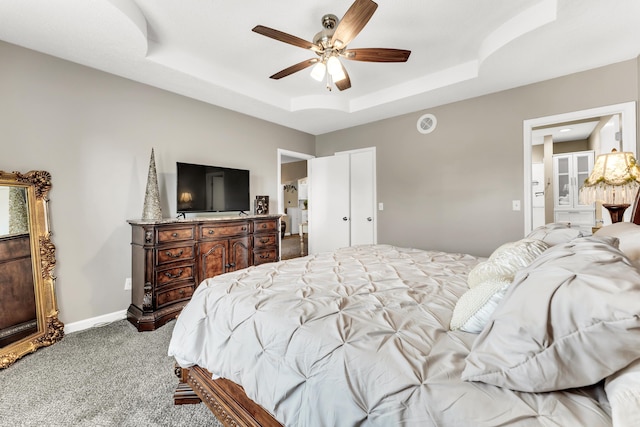 280 W Woodland Dr Unit Ld, Branson, MO 65616 - carpeted bedroom with a raised ceiling, ceiling fan, and ensuite bath