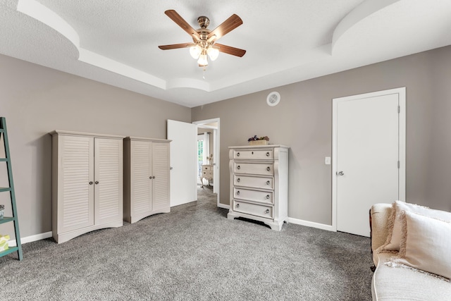 280 W Woodland Dr Unit Ld, Branson, MO 65616 - bedroom featuring a tray ceiling, carpet, multiple closets, and a ceiling fan