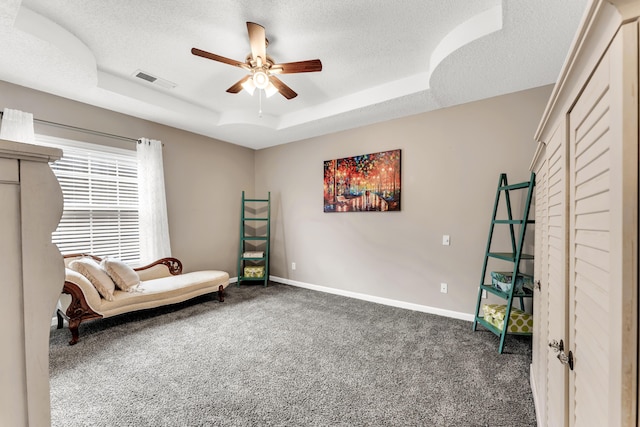 280 W Woodland Dr Unit Ld, Branson, MO 65616 - sitting room with a raised ceiling, dark carpet, ceiling fan, and a textured ceiling