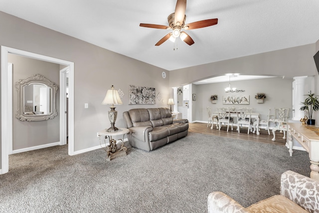280 W Woodland Dr Unit Ld, Branson, MO 65616 - carpeted living room with ceiling fan, a chandelier, and arched walkways