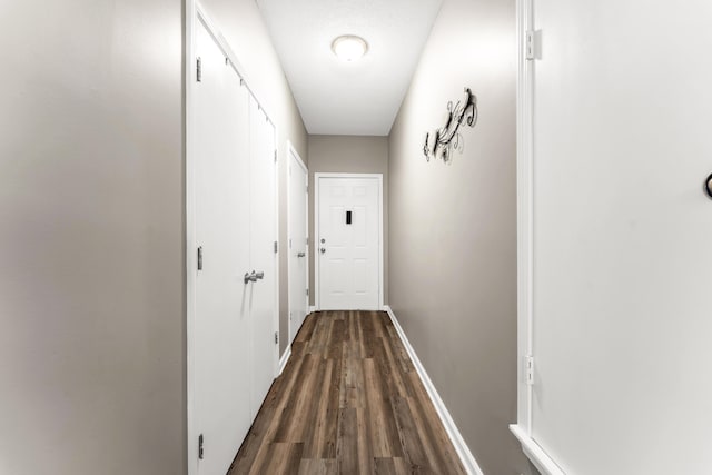 280 W Woodland Dr Unit Ld, Branson, MO 65616 - hallway with dark wood-style floors and baseboards