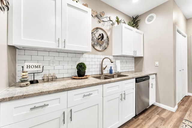 280 W Woodland Dr Unit Ld, Branson, MO 65616 - kitchen featuring dishwasher, light wood-style floors, white cabinets, and tasteful backsplash