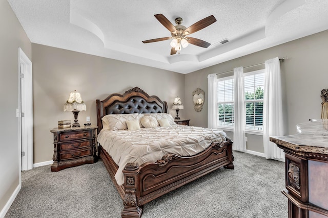 280 W Woodland Dr Unit Ld, Branson, MO 65616 - bedroom with carpet floors, a tray ceiling, a textured ceiling, and a ceiling fan