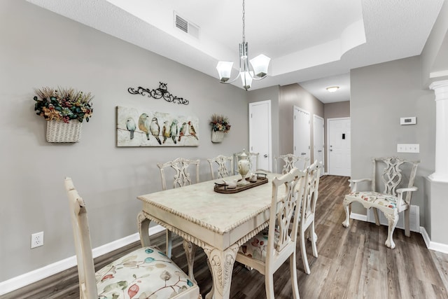 280 W Woodland Dr Unit Ld, Branson, MO 65616 - dining room with wood finished floors, a raised ceiling, and a chandelier