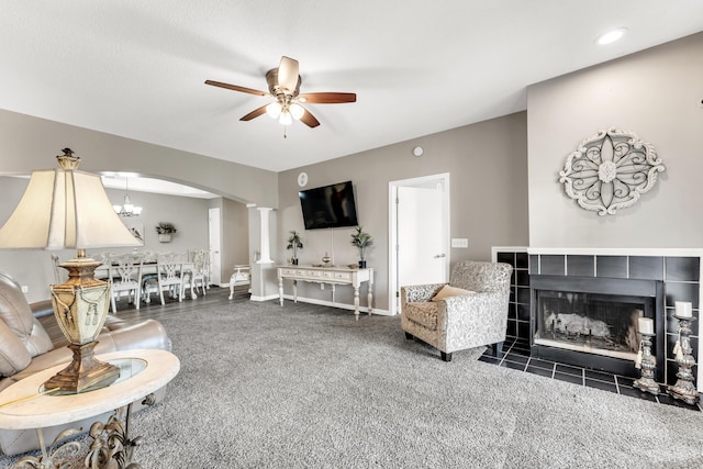 280 W Woodland Dr Unit Ld, Branson, MO 65616 - living room featuring a ceiling fan, arched walkways, carpet, a fireplace, and recessed lighting