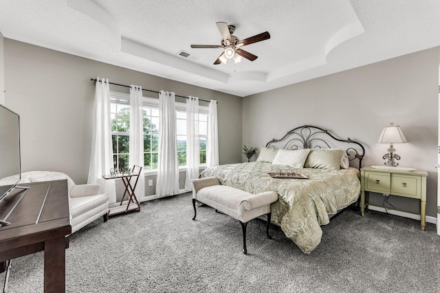 280 W Woodland Dr Unit Ld, Branson, MO 65616 - carpeted bedroom featuring a tray ceiling, a ceiling fan, and a textured ceiling