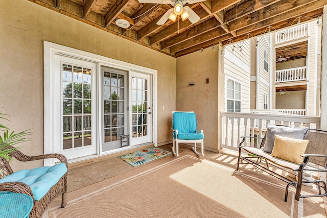 280 W Woodland Dr Unit Ld, Branson, MO 65616 - sunroom featuring healthy amount of natural light, a ceiling fan, and beamed ceiling