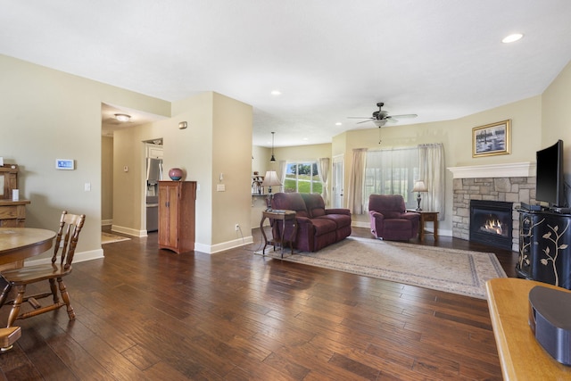 715 S Oak Terrace Dr, Nixa, MO 65714 - living room featuring ceiling fan, a stone fireplace, wood-type flooring, and recessed lighting