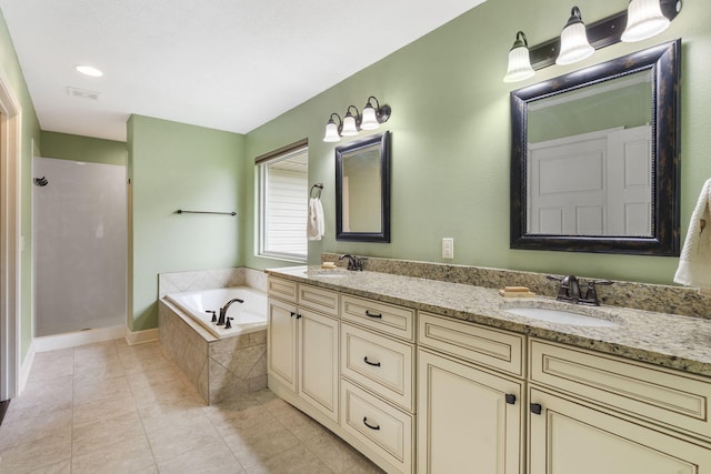 715 S Oak Terrace Dr, Nixa, MO 65714 - full bath featuring a garden tub, double vanity, walk in shower, and tile patterned flooring