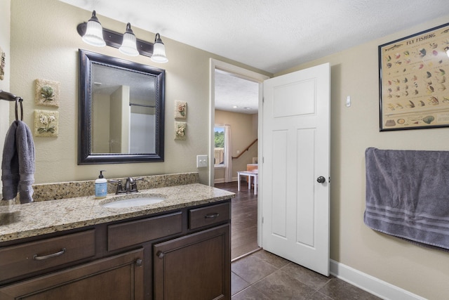 715 S Oak Terrace Dr, Nixa, MO 65714 - bathroom with vanity, tile patterned floors, and a textured ceiling