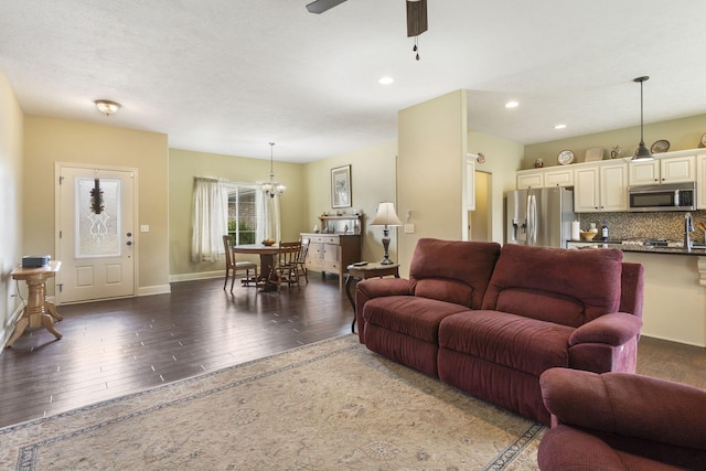 715 S Oak Terrace Dr, Nixa, MO 65714 - living room with wood-type flooring, ceiling fan, recessed lighting, and a chandelier