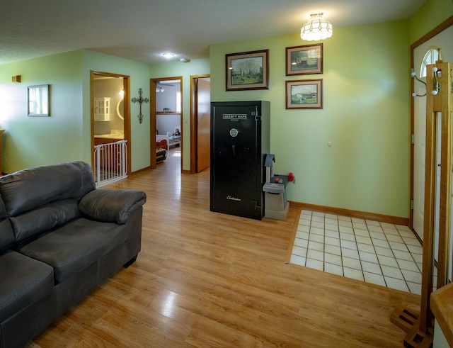 9396 Lawrence Unit 2040, Miller, MO 65707 - living area featuring light wood-style flooring and baseboards