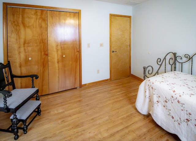 9396 Lawrence Unit 2040, Miller, MO 65707 - bedroom with light wood finished floors and a closet