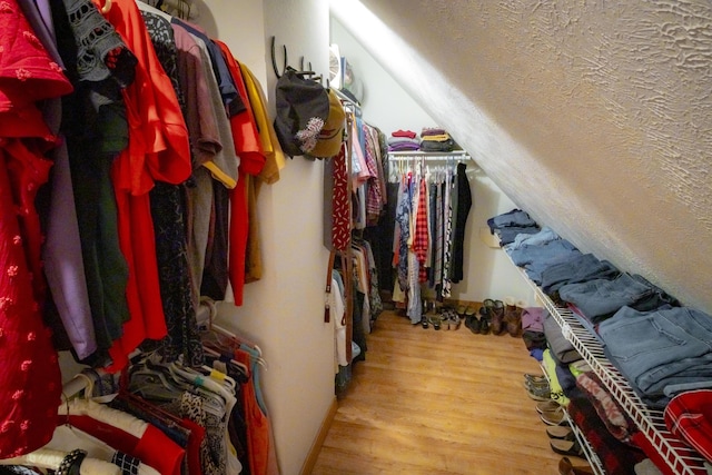 9396 Lawrence Unit 2040, Miller, MO 65707 - spacious closet with wood finished floors and lofted ceiling