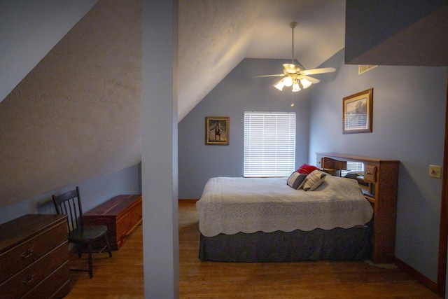 9396 Lawrence Unit 2040, Miller, MO 65707 - bedroom with lofted ceiling, wood finished floors, and ceiling fan
