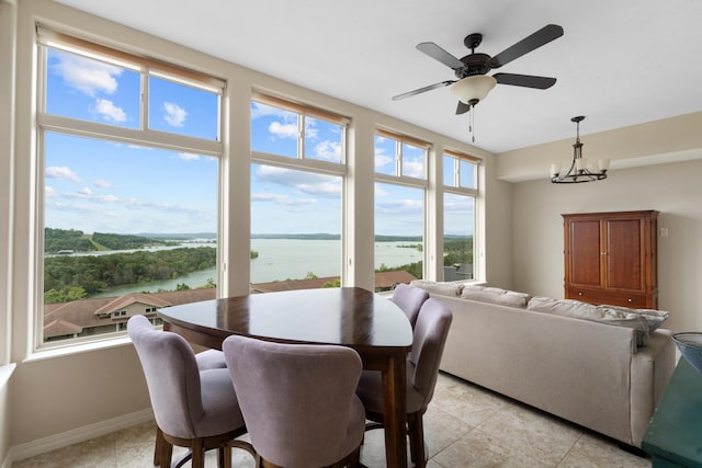 200 Majestic Dr Unit 1-303, Branson, MO 65616 - dining space featuring a water view, a chandelier, light tile patterned floors, and ceiling fan