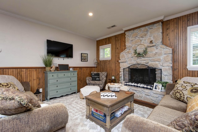 14 Little Creek Ln, Kimberling City, MO 65686 - living room with wooden walls, crown molding, a fireplace, and a wainscoted wall