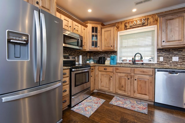 14 Little Creek Ln, Kimberling City, MO 65686 - kitchen featuring appliances with stainless steel finishes, dark stone countertops, tasteful backsplash, glass insert cabinets, and recessed lighting