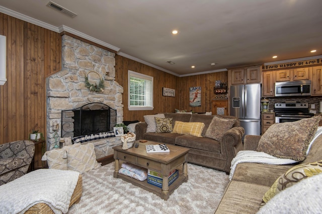 14 Little Creek Ln, Kimberling City, MO 65686 - living area with ornamental molding, wooden walls, a stone fireplace, and recessed lighting