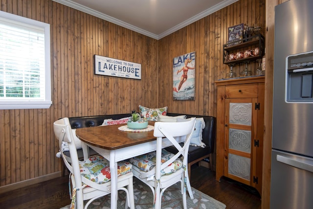 14 Little Creek Ln, Kimberling City, MO 65686 - dining space featuring wood finished floors, ornamental molding, and wooden walls