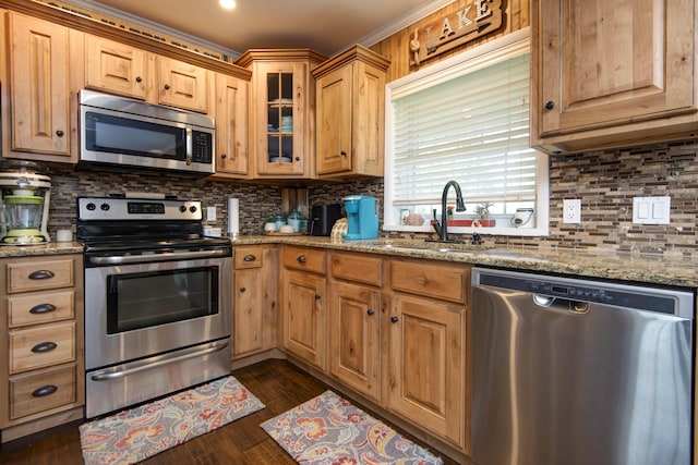 14 Little Creek Ln, Kimberling City, MO 65686 - kitchen with appliances with stainless steel finishes, light stone counters, glass insert cabinets, tasteful backsplash, and dark wood-type flooring