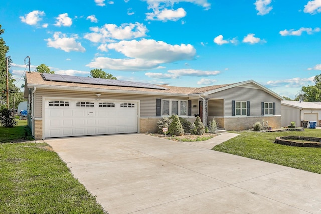 829 W Highland St, Springfield, MO 65807 - ranch-style home featuring brick siding, driveway, solar panels, a front yard, and an attached garage