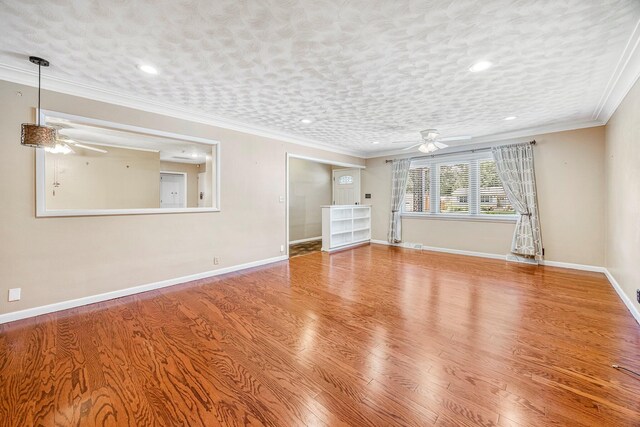 829 W Highland St, Springfield, MO 65807 - unfurnished room with a ceiling fan, crown molding, wood finished floors, and recessed lighting