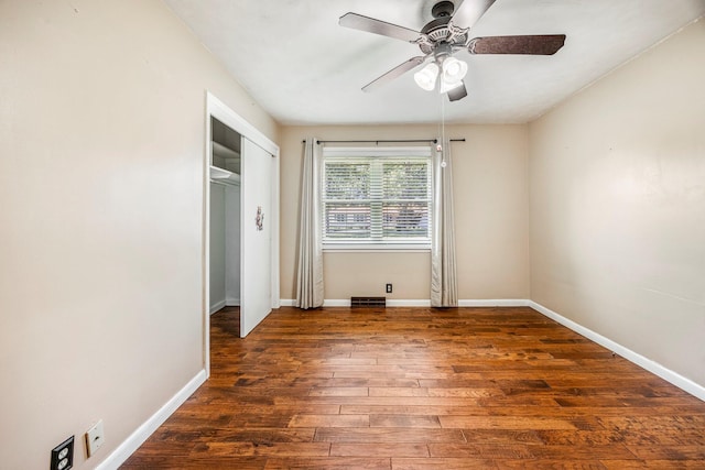 829 W Highland St, Springfield, MO 65807 - unfurnished bedroom with wood finished floors, a closet, and ceiling fan