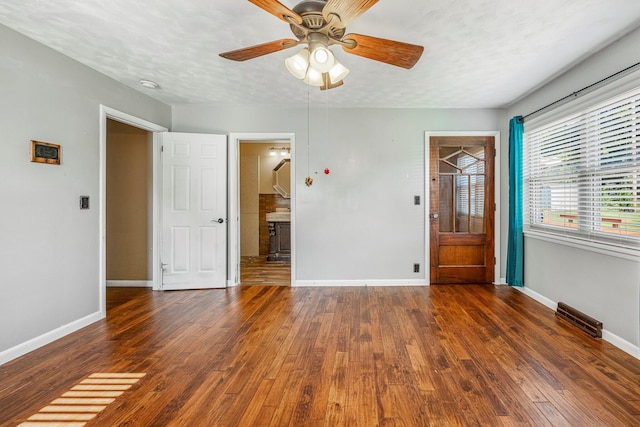 829 W Highland St, Springfield, MO 65807 - empty room with hardwood / wood-style flooring and a ceiling fan
