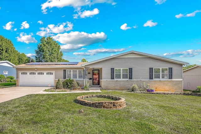829 W Highland St, Springfield, MO 65807 - ranch-style house featuring brick siding, an attached garage, solar panels, driveway, and a front yard