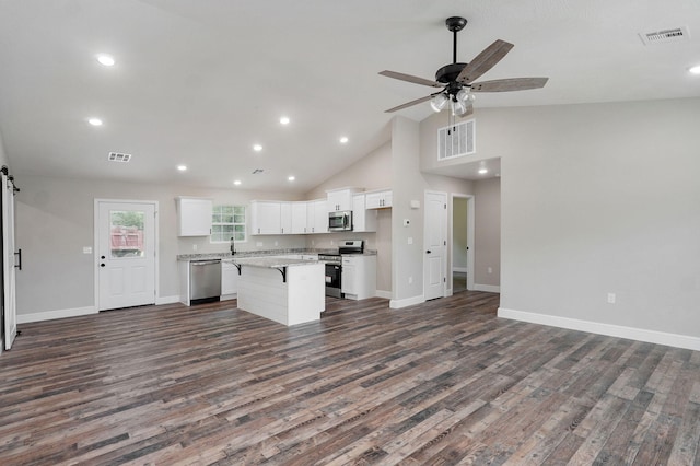 401 E Crescent St, Aurora, MO 65605 - kitchen with stainless steel appliances, open floor plan, white cabinets, a center island, and recessed lighting