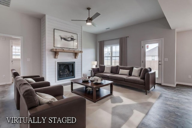 917 S Deerfield Ct, Nixa, MO 65714 - living room featuring plenty of natural light, a ceiling fan, and a large fireplace