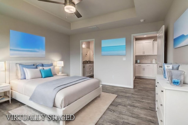 917 S Deerfield Ct, Nixa, MO 65714 - bedroom featuring dark wood finished floors and connected bathroom