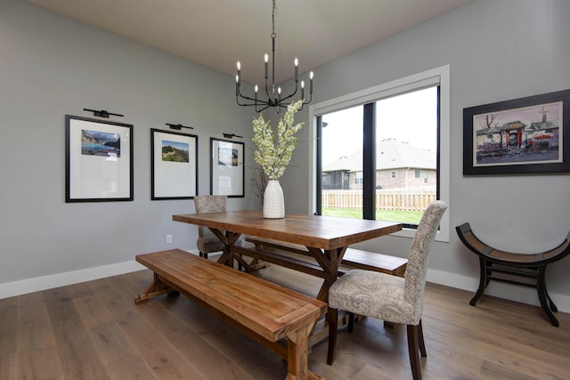 1510 N Lake Edge Dr, Springfield, MO 65802 - dining area featuring a chandelier and wood finished floors