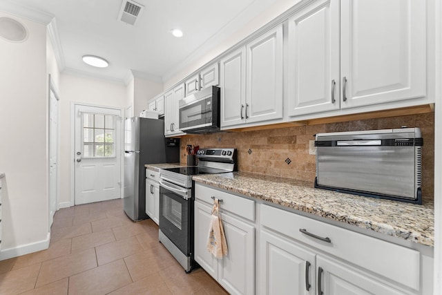 110 Cottonwood Trl Unit 2D, Branson, MO 65616 - kitchen featuring stainless steel appliances, crown molding, white cabinetry, backsplash, and light tile patterned floors