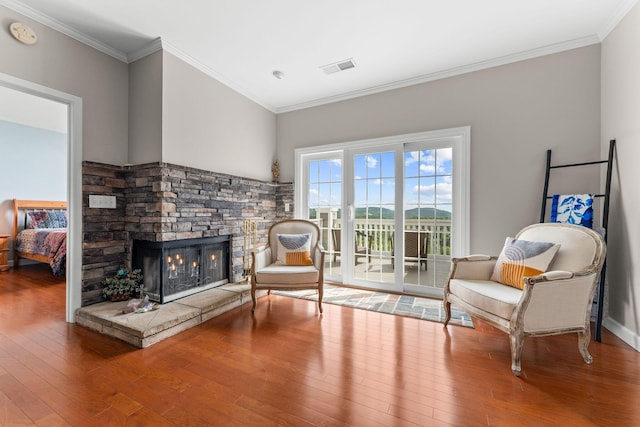 110 Cottonwood Trl Unit 2D, Branson, MO 65616 - living area with wood-type flooring, a fireplace, and crown molding
