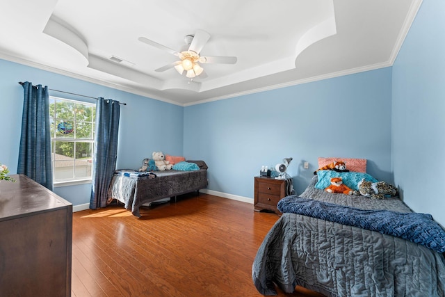 110 Cottonwood Trl Unit 2D, Branson, MO 65616 - bedroom featuring a tray ceiling, wood finished floors, a ceiling fan, and ornamental molding