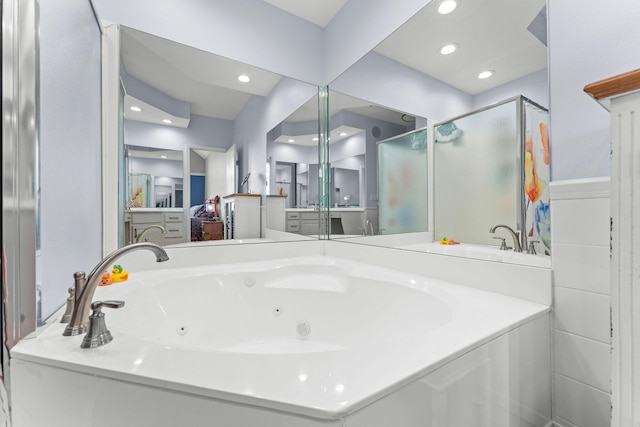 110 Cottonwood Trl Unit 2D, Branson, MO 65616 - bathroom featuring a stall shower, a tub with jets, recessed lighting, and vanity