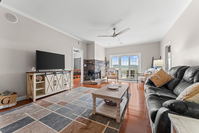 110 Cottonwood Trl Unit 2D, Branson, MO 65616 - living area featuring wood finished floors, ornamental molding, ceiling fan, and a stone fireplace