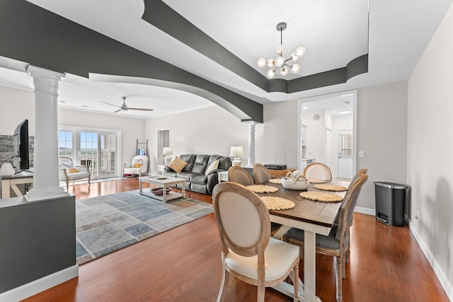 110 Cottonwood Trl Unit 2D, Branson, MO 65616 - dining room featuring ornate columns, wood finished floors, a ceiling fan, and arched walkways