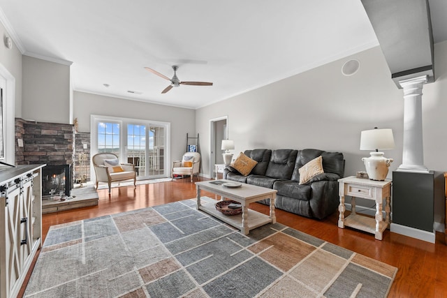 110 Cottonwood Trl Unit 2D, Branson, MO 65616 - living room featuring crown molding, ceiling fan, decorative columns, wood finished floors, and a fireplace