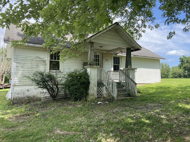 560 S Eagle Ave, Norwood, MO 65717 - view of front of property with a front lawn and a shingled roof